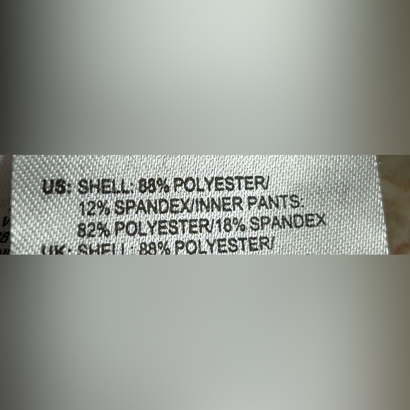 ADIDAS white skort with pleats on the bottom  half . Then two horizontal bands. - Picture 10 of 11